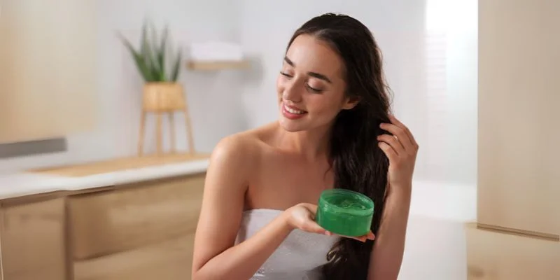 Women Applying Aloe Gel On Hair For Dandruff